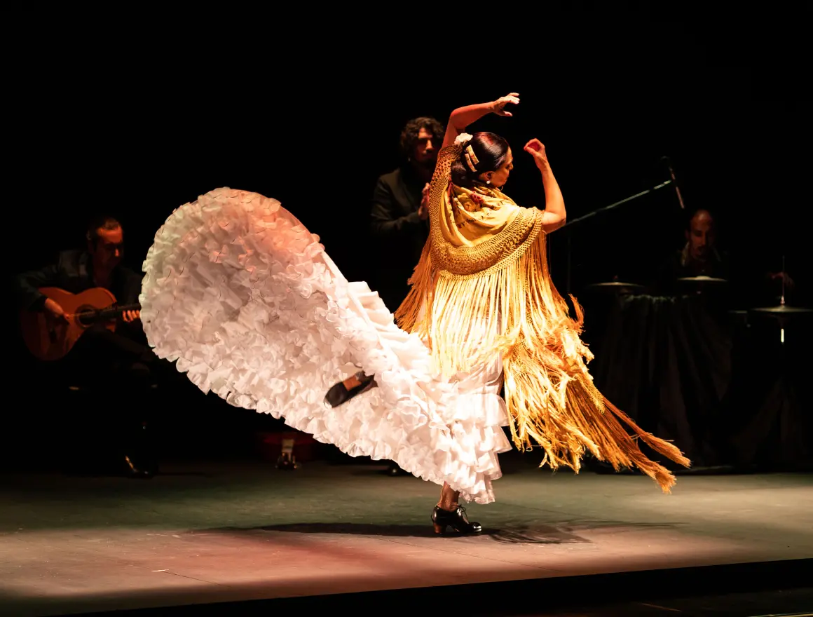 A woman dancing flamenco at the Authentic Flamenco show in San Diego
